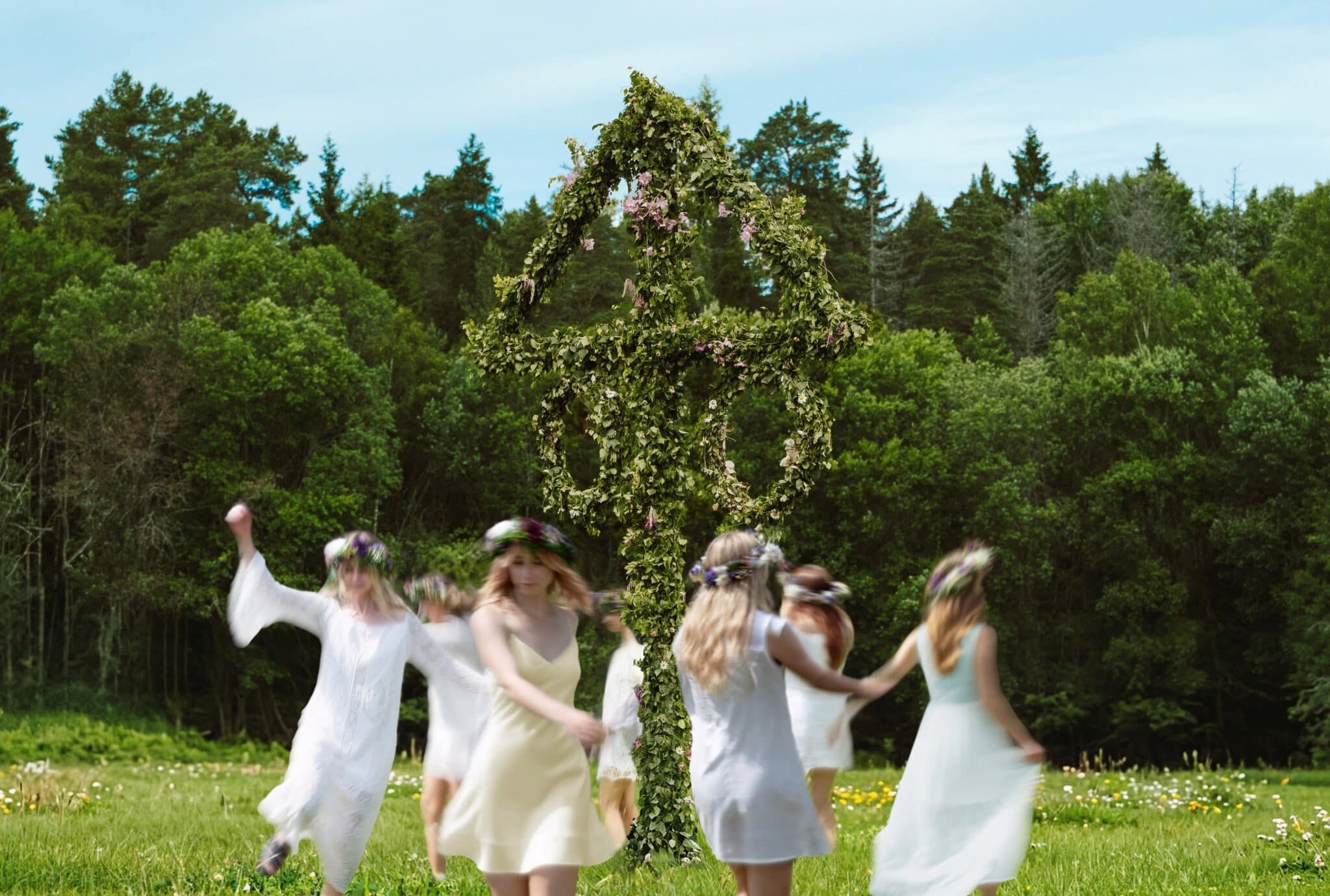 Midsummer celebration around a maypole in Sweden