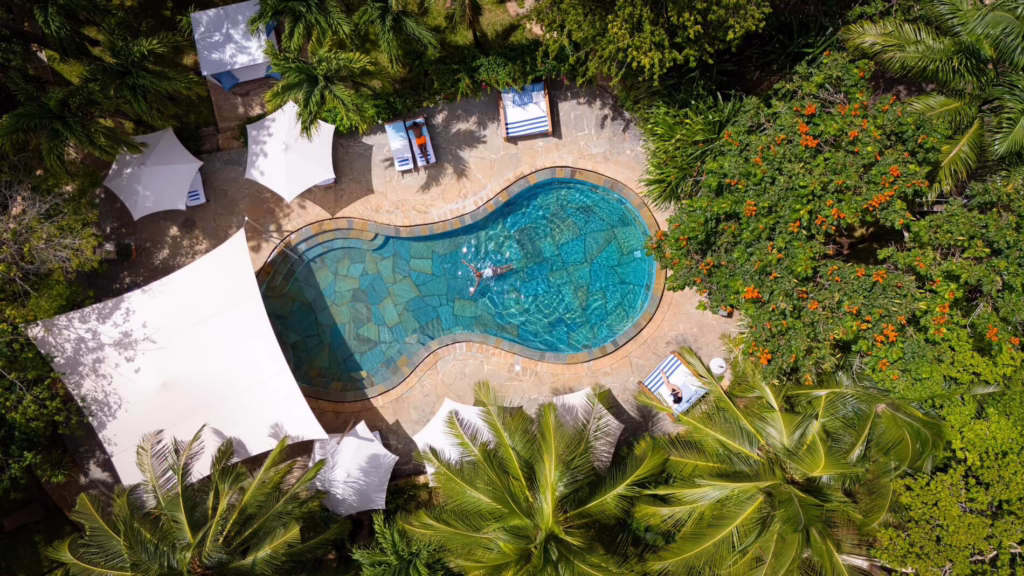 Aerial view of the pool among palms at Almanara Villas on Diani Beach, Kenya