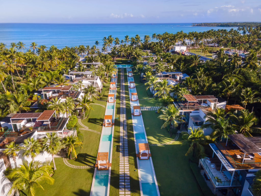 Aerial view of Sublime Samaná resort among palms on the Dominican Republic coast